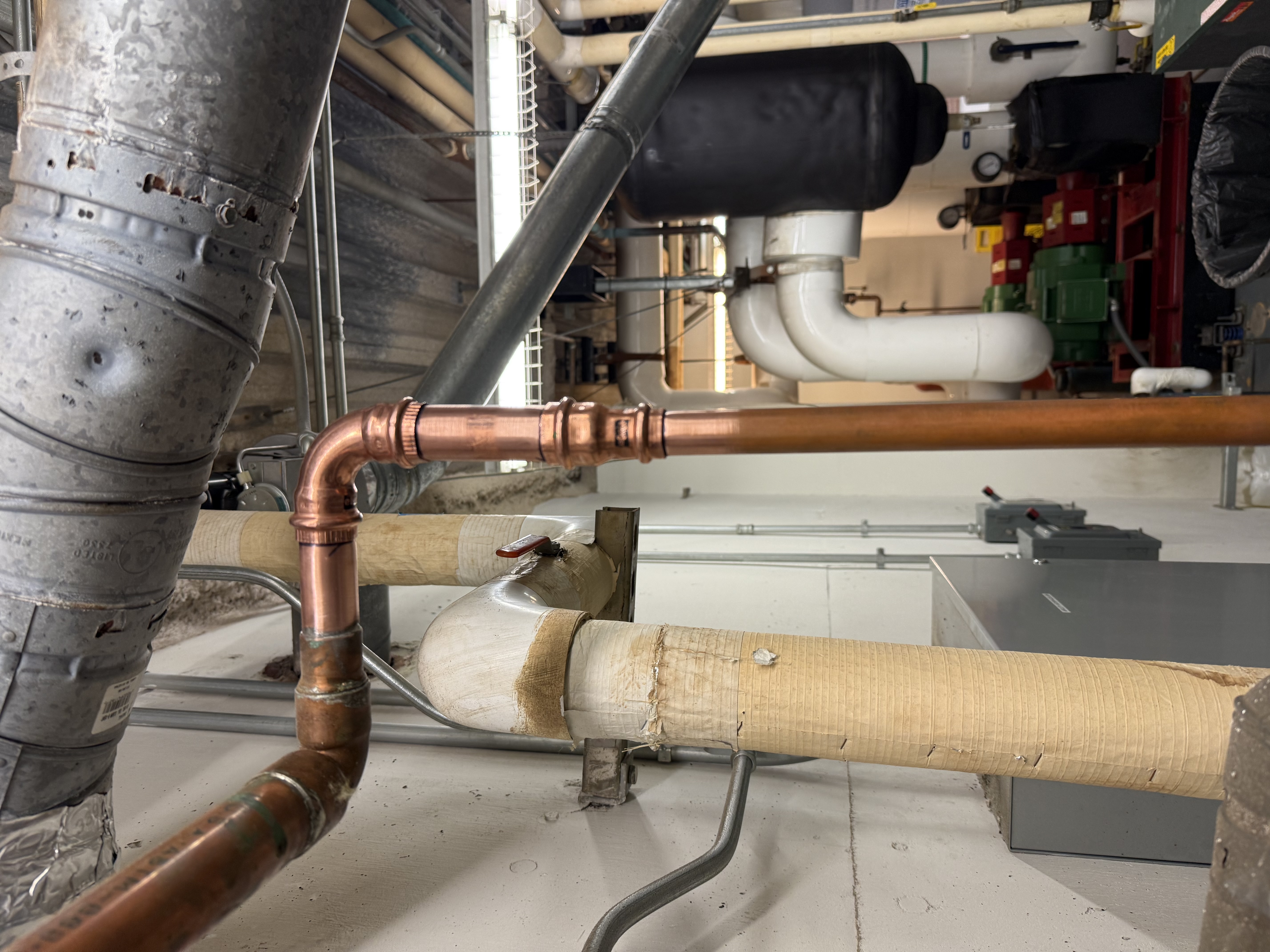 Copper repipe in commercial office building mechanical room