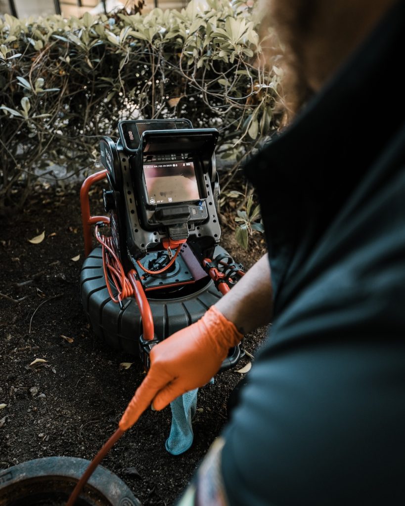 Using a high-resolution sewer camera to diagnose blockages and pipe damage without digging