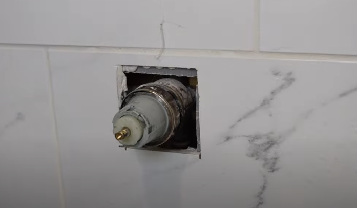Removing the metal collar in the shower handle