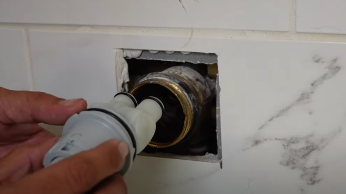 Putting in a new cartridge in the shower handle