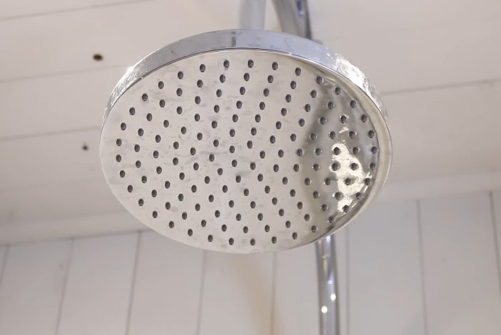 checking shower head for leaks