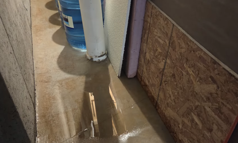 Water from burst pipe and flooding in basement